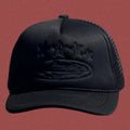 Cortiez All-Black Vintage Trucker Hat with Tonal Stars and Cruise Ship Graphic